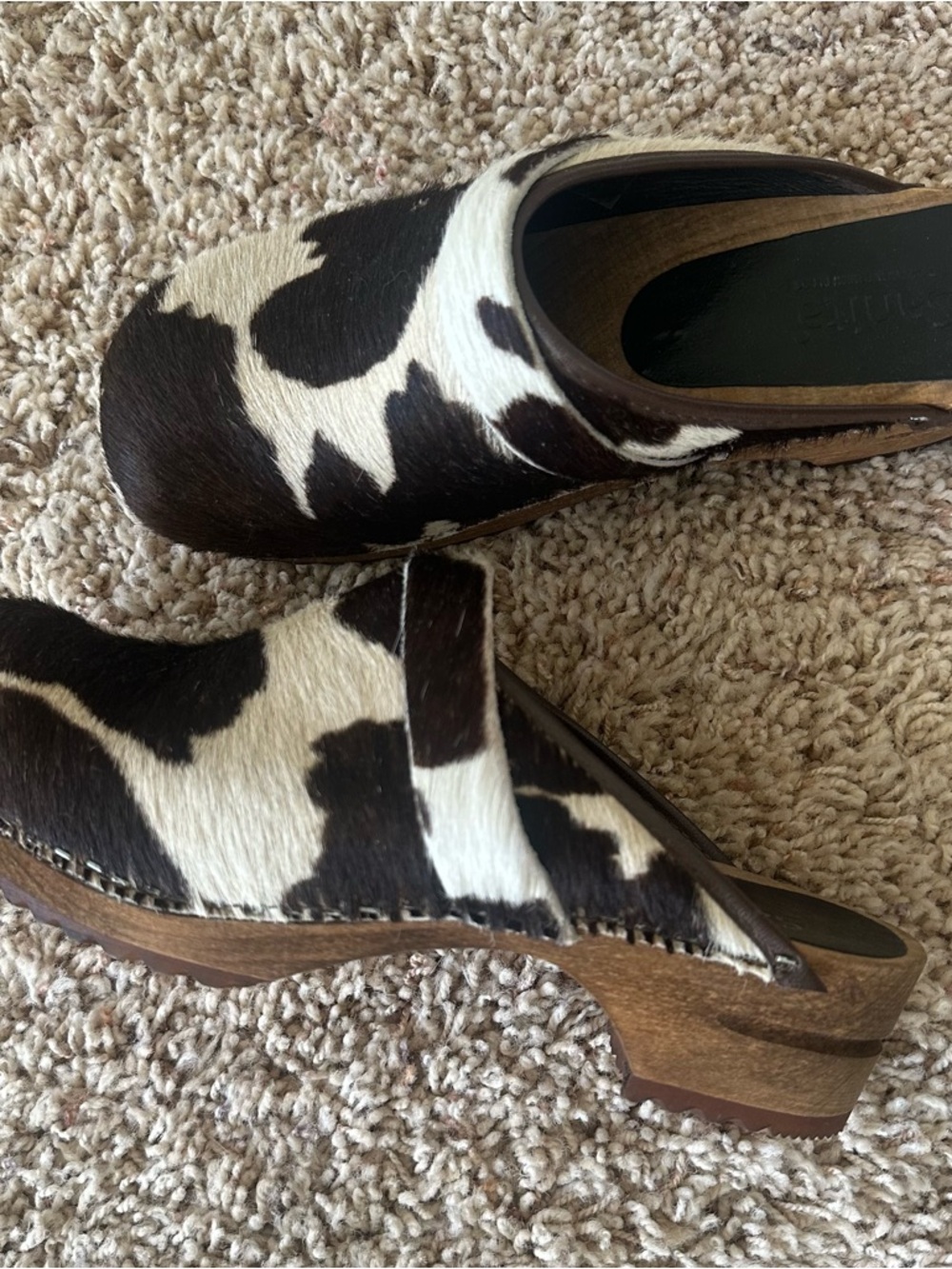Sanita Black and White Cowhide Clogs